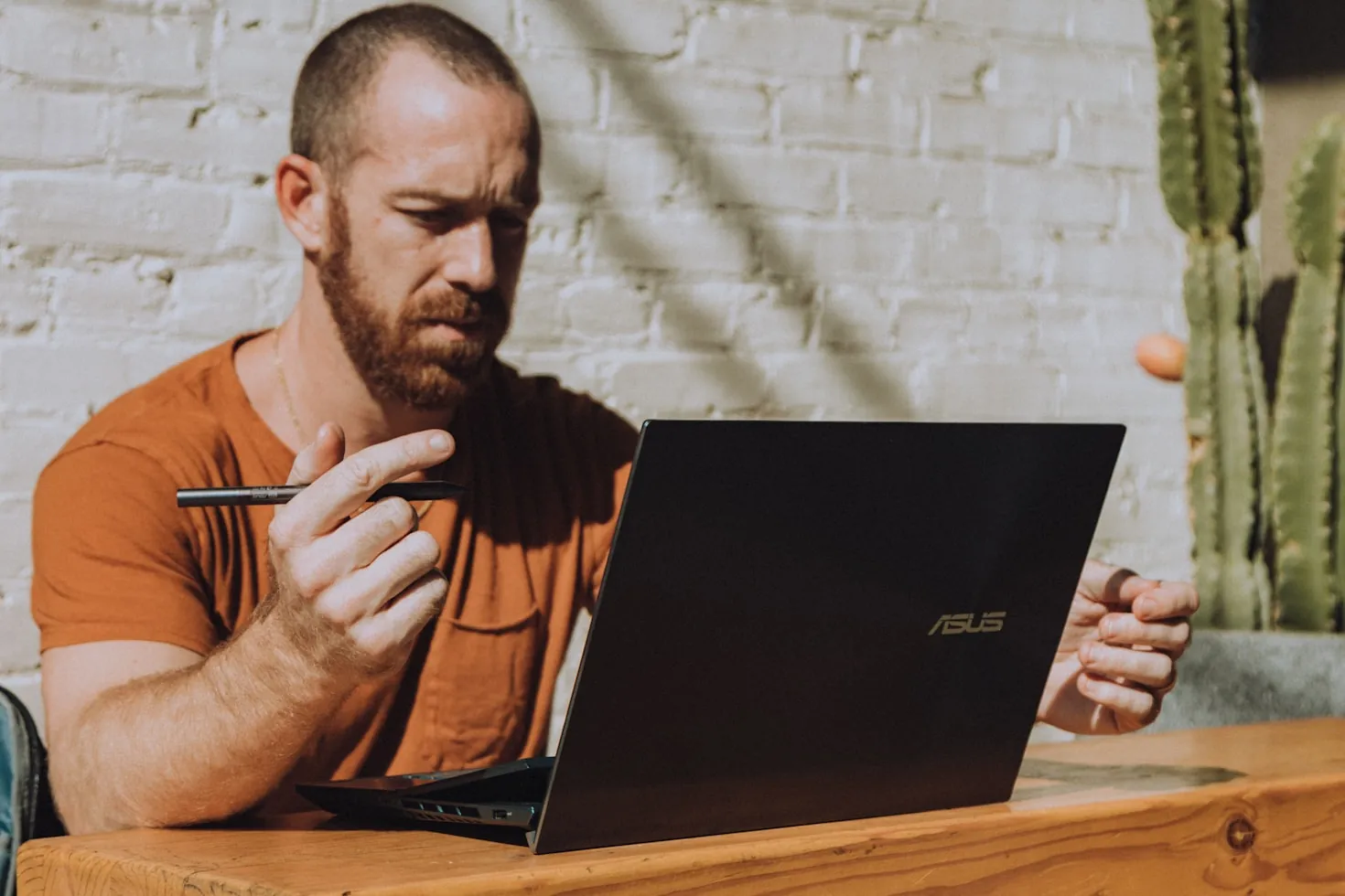 Person learning at a desk with a laptop